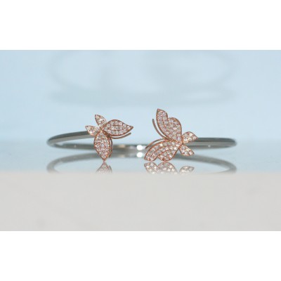 18 karat two tone diamond butterfly bangle.