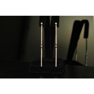 18 karat two bar pave earrings.